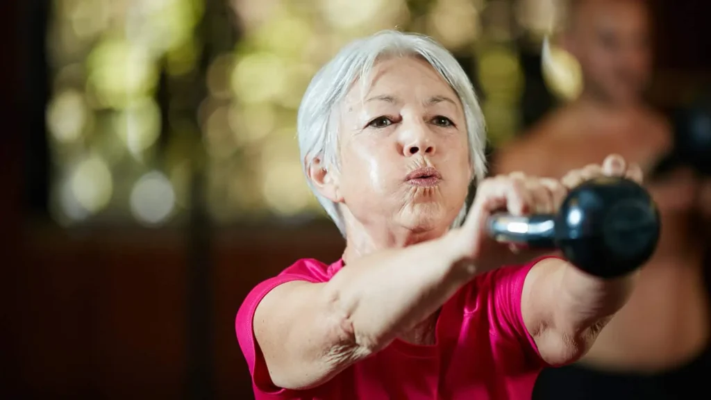 Toning Bingo Wings: Effective Exercises and Tips for Achieving Sleeker Arms 2 Person performing arm exercises with dumbbells Surrey