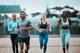 Sculpting Sleek Arms: The Essential Role of Cardio in Toning Without Bulking Up 3 image of people running to incorporate cardio Surrey exercise into their life to help tone arms and body.